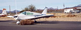 Piper Cherokee amid tumbleweeds