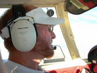 Adam flying over the Grand Canyon (background indistinct)