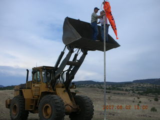 Young -- Chapman Ranch Airport - loader raising Arv and Bob for wind sock replacement