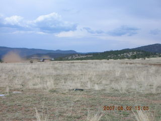 Young -- Chapman Ranch Airport - loader raising Arv and Bob for wind sock replacement