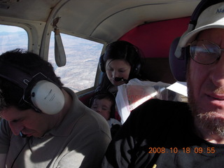 Richard, Jane, Abigail all all asleep and Adam flying N4372J