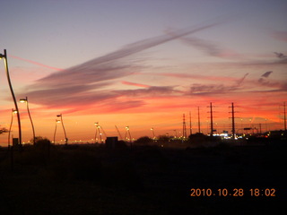 contrail-streaked sunset like tracks in the snow