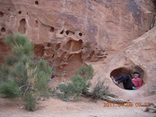 1453 7j9. Arches Devil's Garden hike - Adam in hole in rock