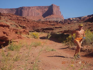 86 7qb. Canyonlands National Park - Lathrop trail hike - Adam running (tripod)