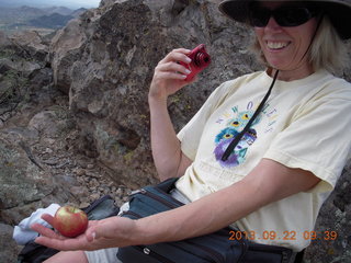 Elephant Mountain hike - Beth taking a picture of an apple