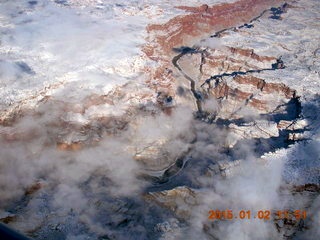 aerial - snow and clouds and canyon - Colorado River