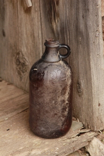 564 8zw. Calamity Mine camp site -  bottle