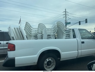 guy hauling tables and chairs