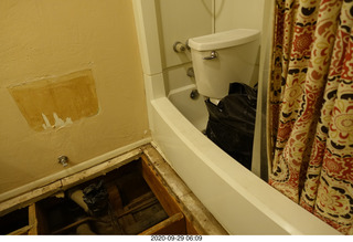 hallway with we-moved-downstairs sign and mezzuzah